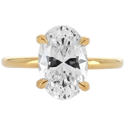 Image of oval diamond engagement ring with split collar halo in yellow gold | Buchroeders Jewelers