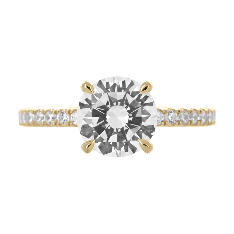 Image of round diamond engagement ring with split collar and pave band in yellow gold | Buchroeders Jewelers