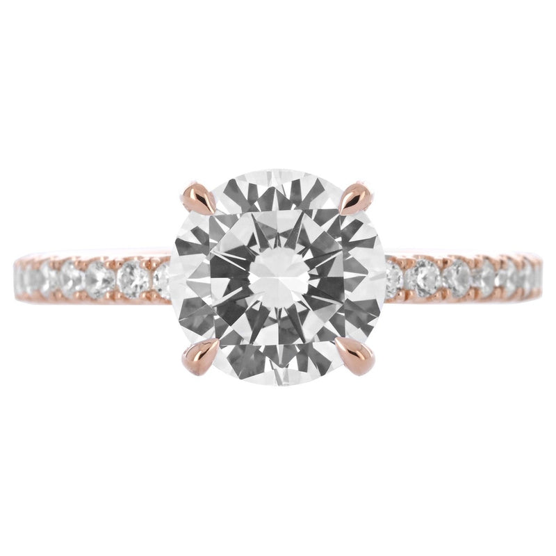 Image of round diamond engagement ring with split collar and pave band in rose gold | Buchroeders Jewelers