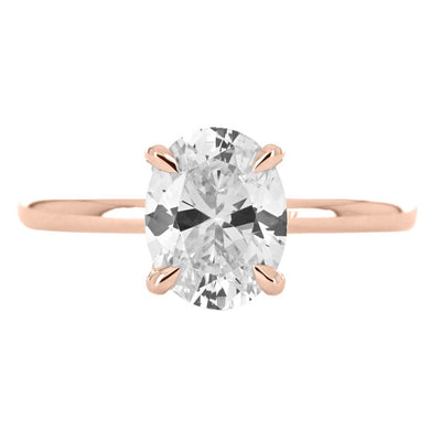 Image of oval diamond engagement with split collar halo in rose gold | Buchroeders Jewelers