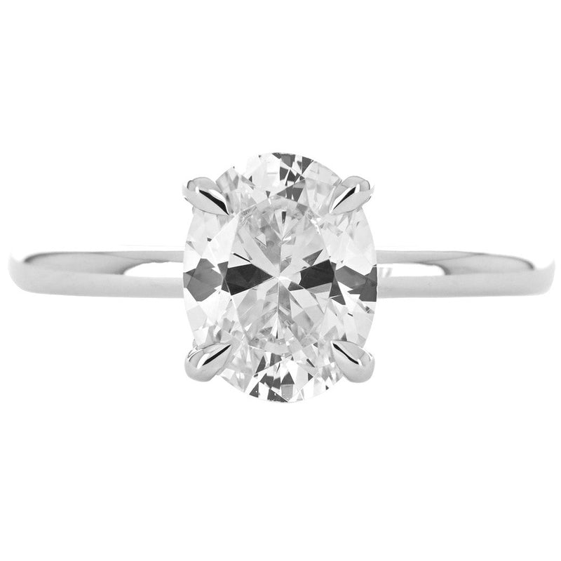 Image of round diamond engagement ring with split collar halo in white gold | Buchroeders Jewelers