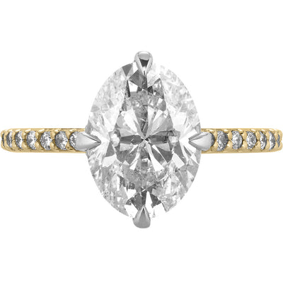 Image of oval diamond engagement ring with compass prongs and pave band in yellow gold | Buchroeders Jewelers